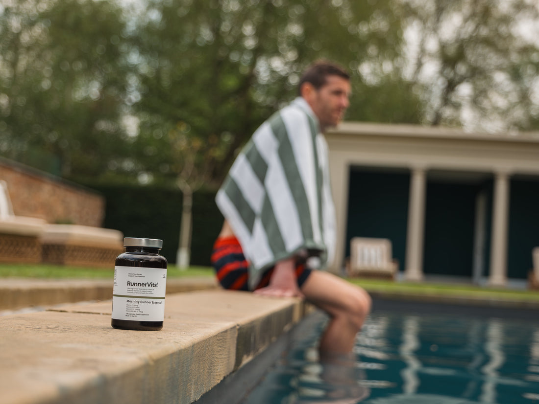 Runner resting with legs in a pool after a race